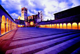 Assisi - the Basilica of San Francesco is even more evocative at sunset - De Agostini Picture Library