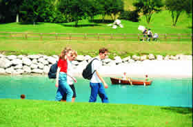 trekking by the lake - Credit - APT Dolomiti di Brenta - Altopiano della Paganella